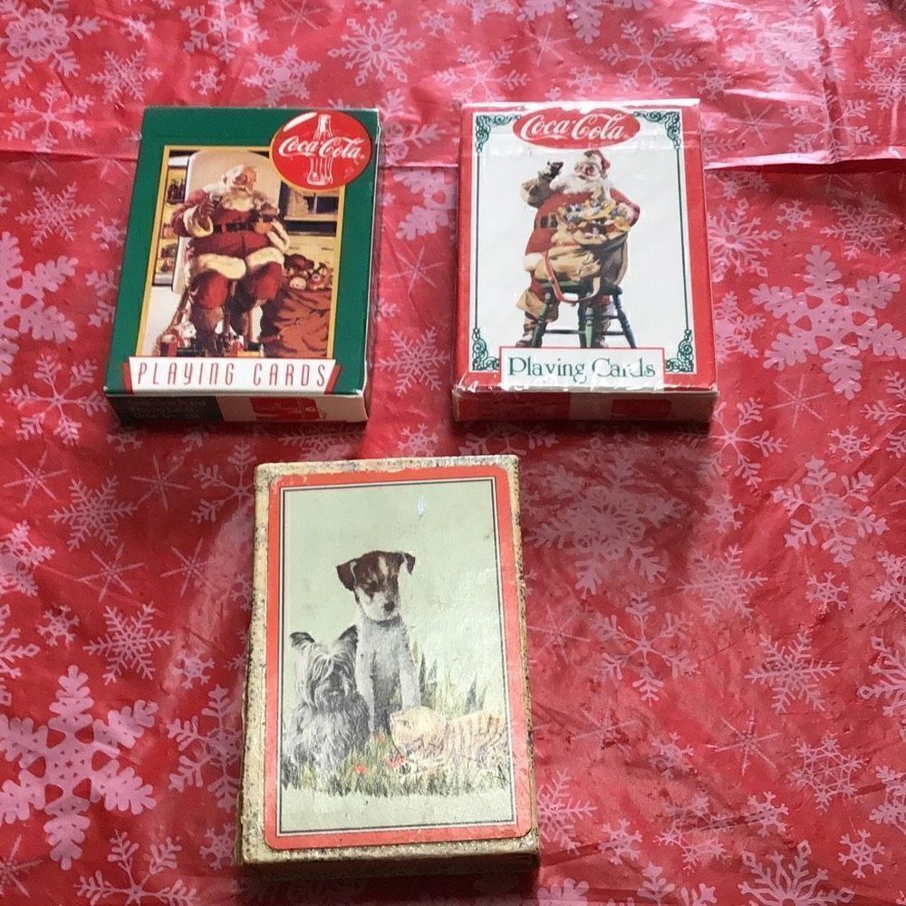 Vintage playing cards two of which are Coca-Cola